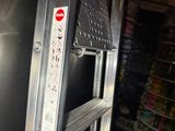 a close up of a metal step ladder in a store