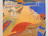 an image of a vintage poster of a woman sitting on a beach
