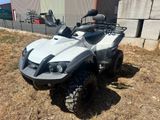 an image of a four wheeler atv parked in the grass