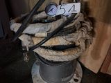 a hose that is sitting on top of a pile of wood