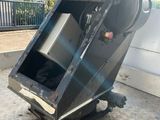 an image of a garbage truck with its door open