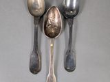 three spoons and a spoon with a face on them