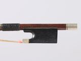 a close up of a violin bow with a wooden handle