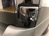 reflection of a man taking a picture of himself in a mirror
