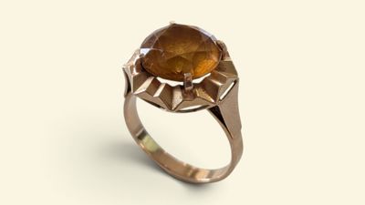 a close up of a ring with a stone on it