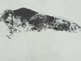 a black and white photo of a person on skis in the snow