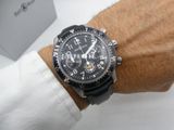 a man that is wearing a watch on his wrist