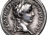 a close up of a silver coin with a woman ' s face on it