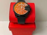 a watch that is sitting on top of a red box