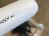 a close up of a remote control on a plane