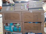many boxes stacked on top of each other in a warehouse