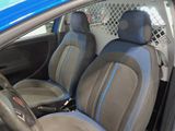 a blue car with black seats in the back of it