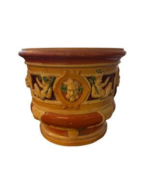 an image of a planter with a flower design on it
