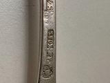 an old spoon with the name of a person on it