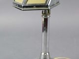 a small lamp that is on a metal stand