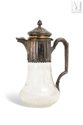 an antique silver and glass coffee pot with a lid