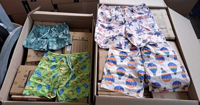 two boxes of underwear sitting next to each other on a table