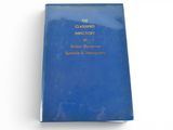 an old blue book sitting on top of a white table