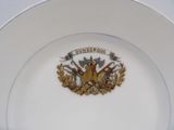 a plate with a coat of arms on it