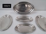six silver trays and a bowl on a table with a price tag