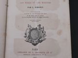 an old book with a picture of a clock on it