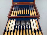 a wooden box with a set of silverware in it