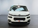 the front of a white citrole parked in a white room