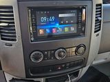 a car dashboard with a digital display in the center