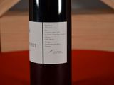 a bottle of wine that is sitting on a table