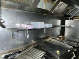 a kitchen with a stove, oven, and other appliances in it
