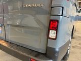 an image of a silver van parked in a garage