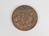 an image of a gold coin with a woman ' s face on it