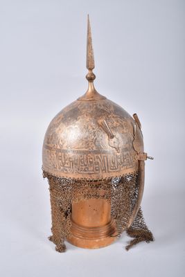 an old helmet with a chain around the neck and a chain around the neck