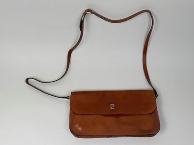 an image of a brown purse on a white surface