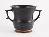 a black vase with two handles on a white background