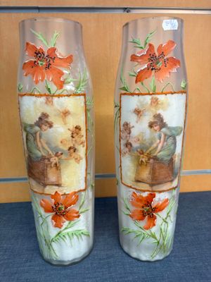 two vases that have pictures of people on them
