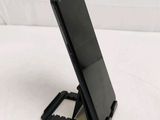 a cell phone that is sitting on a stand