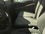a car that has two seats in it and a steering wheel