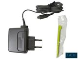 a black ac adapter with a yellow cord and a plastic bag