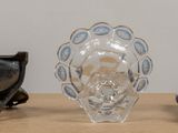 three vases sitting on a table next to each other