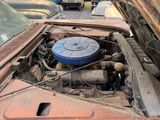 an old car that has a blue engine in it