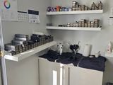 a kitchen with a lot of items on the shelves