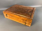 an old wooden box sitting on top of a table