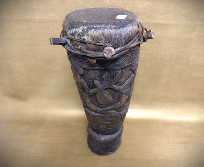 a wooden vase with a decorative design on it