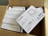 a cardboard box that has a bunch of electronic devices in it