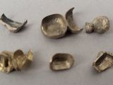 five pieces of metal that have been placed on a table