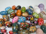 a lot of different colored stones on a white surface