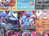 several pokemon cards are displayed on a table in a room