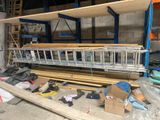 a large rack with many items on it in a warehouse