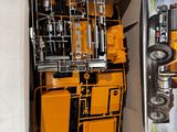 a box with a yellow truck inside of it